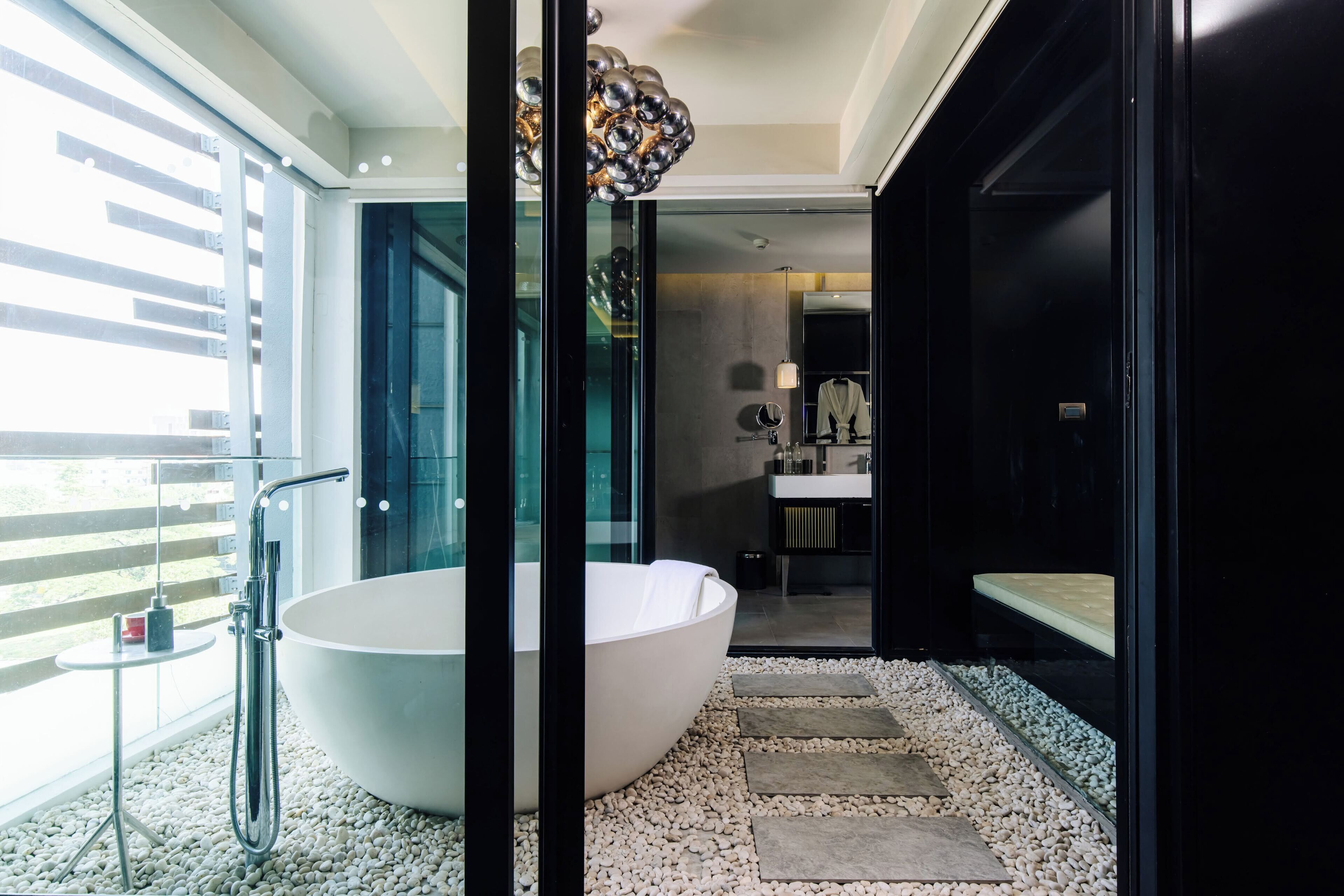 designer toiletries, hair dryer, bathrobes, slippers