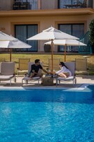 Indoor pool, outdoor pool, open 8:00 AM to 8:00 PM, sun loungers