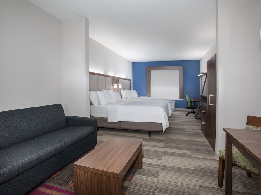 Suite, 2 Queen Beds | In-room safe, desk, iron/ironing board, free cribs/infant beds