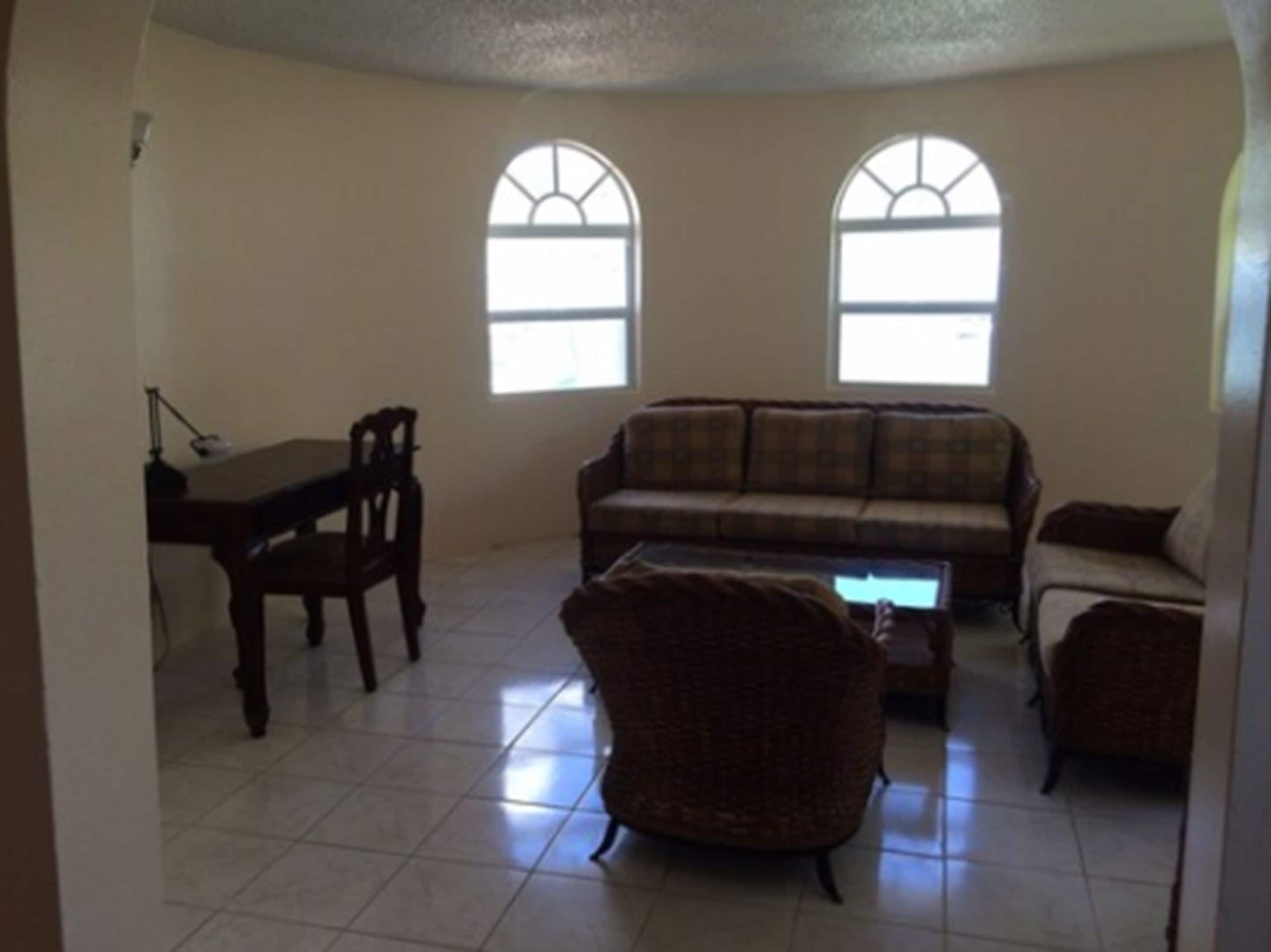 suite, 1 bedroom, sea view (1 king bed) | living area | flat-screen tv