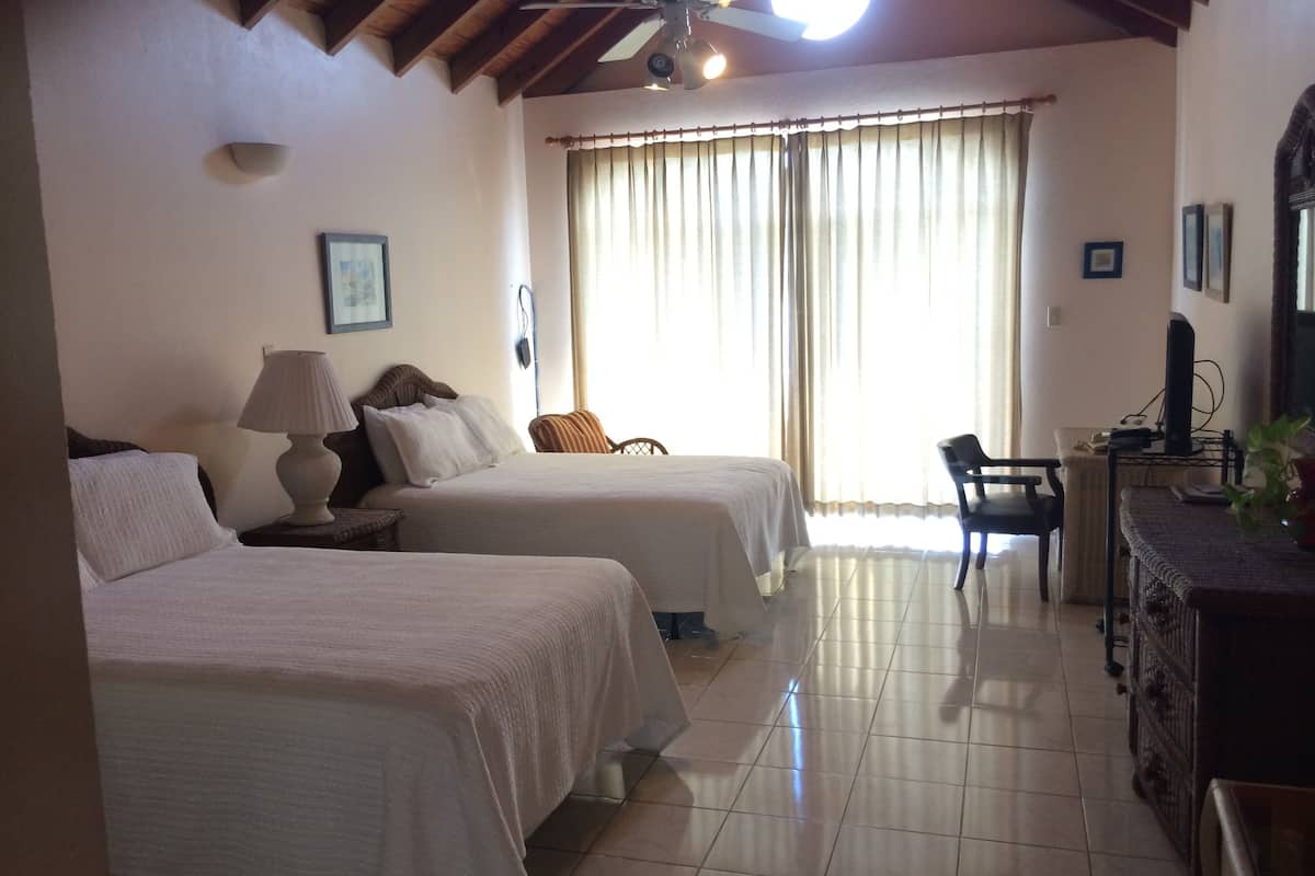 deluxe room, 2 double beds, balcony | premium bedding, in-room safe, desk, iron/ironing board