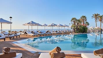 2 outdoor pools, open 10:00 AM to 6:00 PM, pool umbrellas, pool loungers