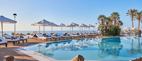 2 outdoor pools, open 10:00 AM to 6:00 PM, pool umbrellas, pool loungers
