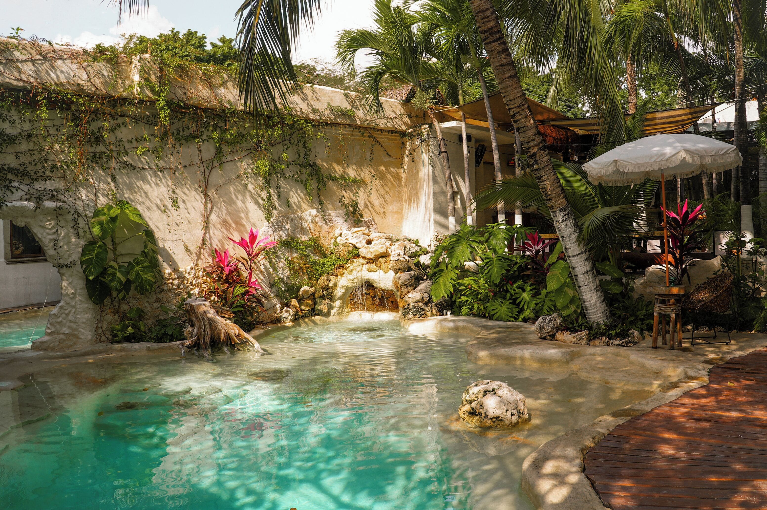 Outdoor pool, open 9:00 AM to 11:00 PM, pool umbrellas, pool loungers