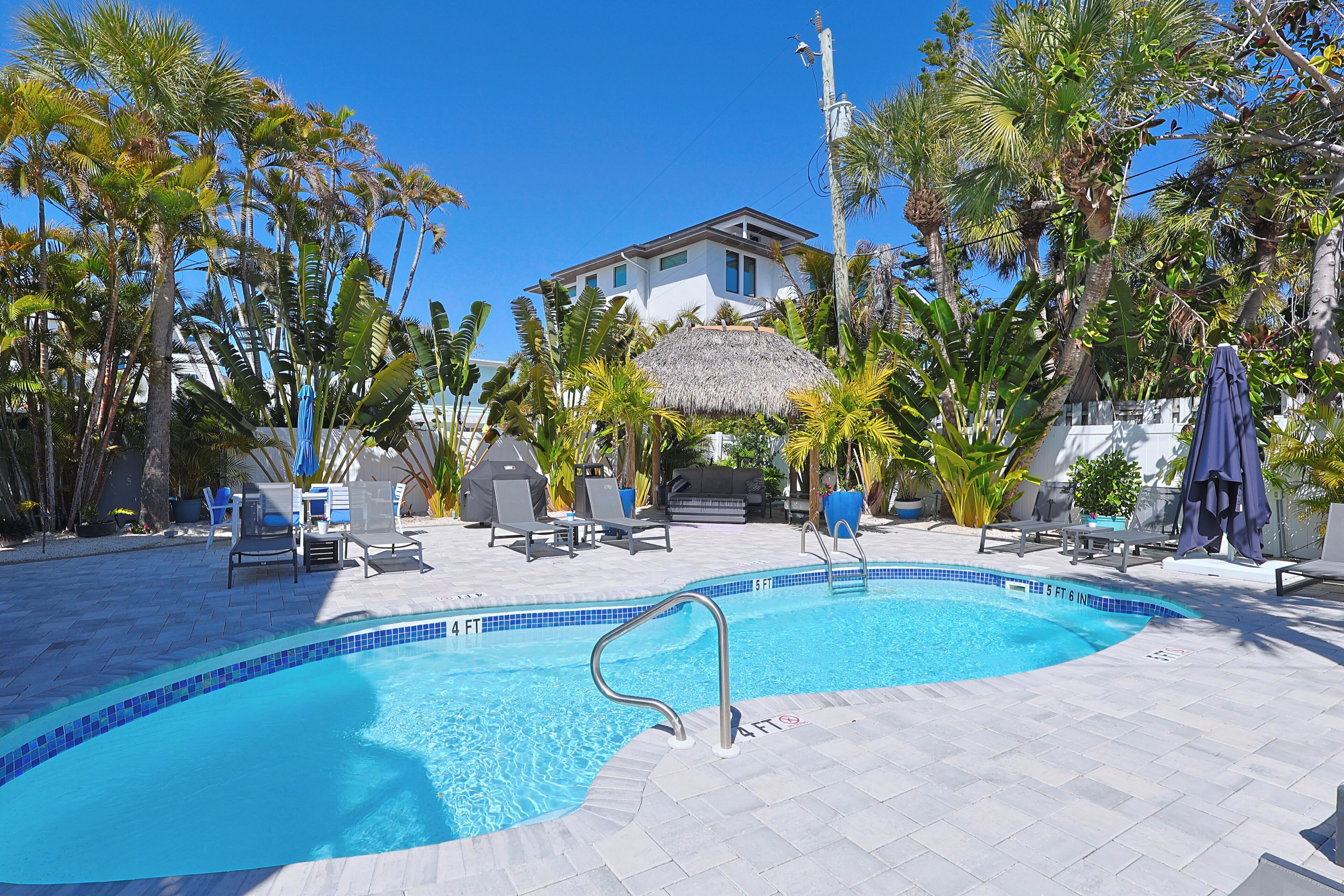 Outdoor pool, a heated pool, open 8:00 AM to 8:00 PM, pool umbrellas