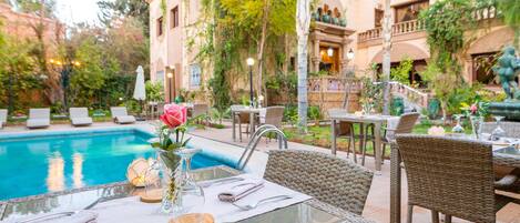 Outdoor pool, pool umbrellas, pool loungers