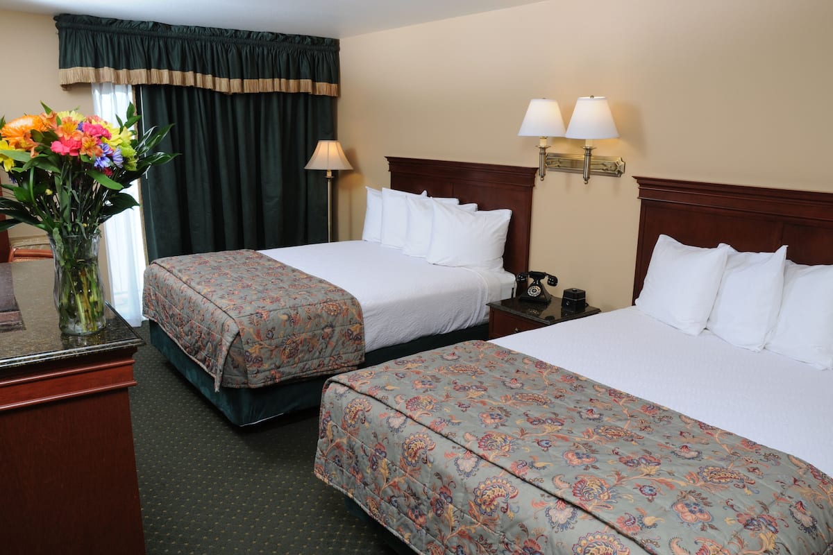 standard double room, 2 queen beds | 1 bedroom, in-room safe, desk, laptop workspace