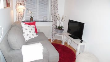 Apartment, 1 Bedroom, Kitchen | Living room | Flat-screen TV