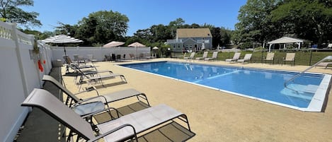 Seasonal outdoor pool, open 8:00 AM to 7:00 PM, pool umbrellas