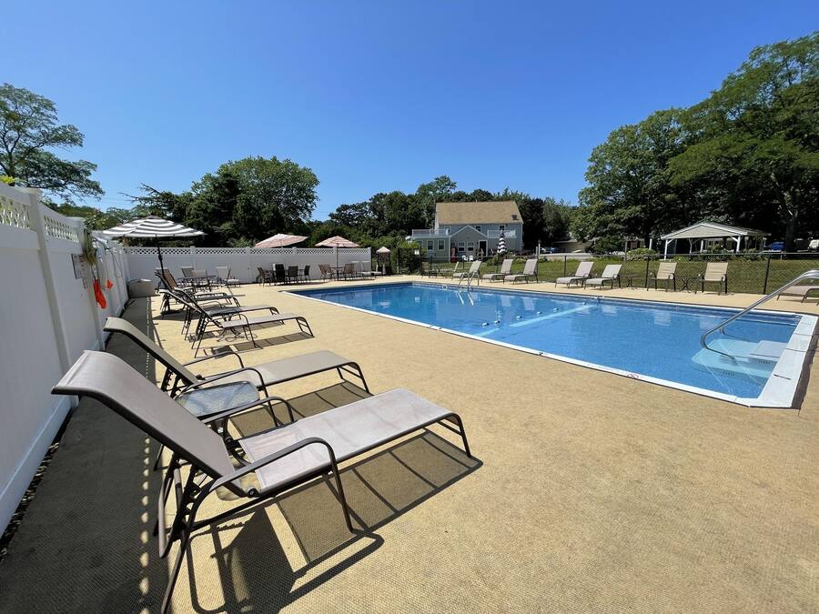 Seasonal outdoor pool, open 8:00 AM to 7:00 PM, pool umbrellas