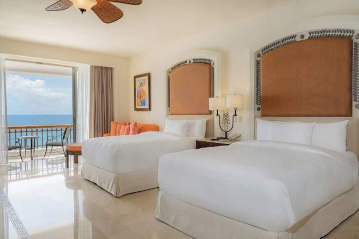 Premium bedding, pillow-top beds, free minibar, in-room safe