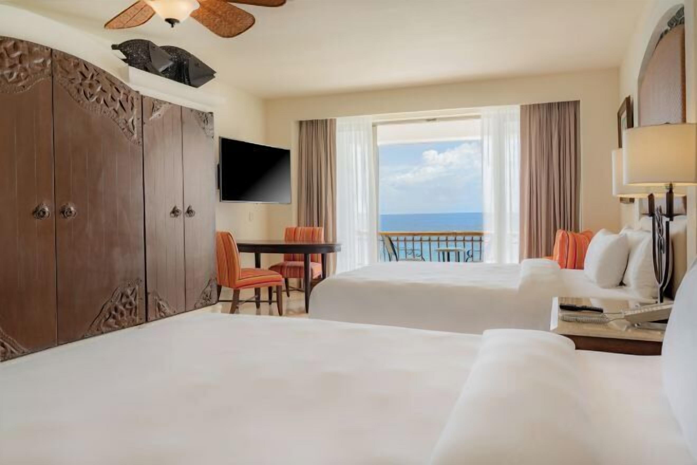 Premium bedding, pillow-top beds, free minibar, in-room safe