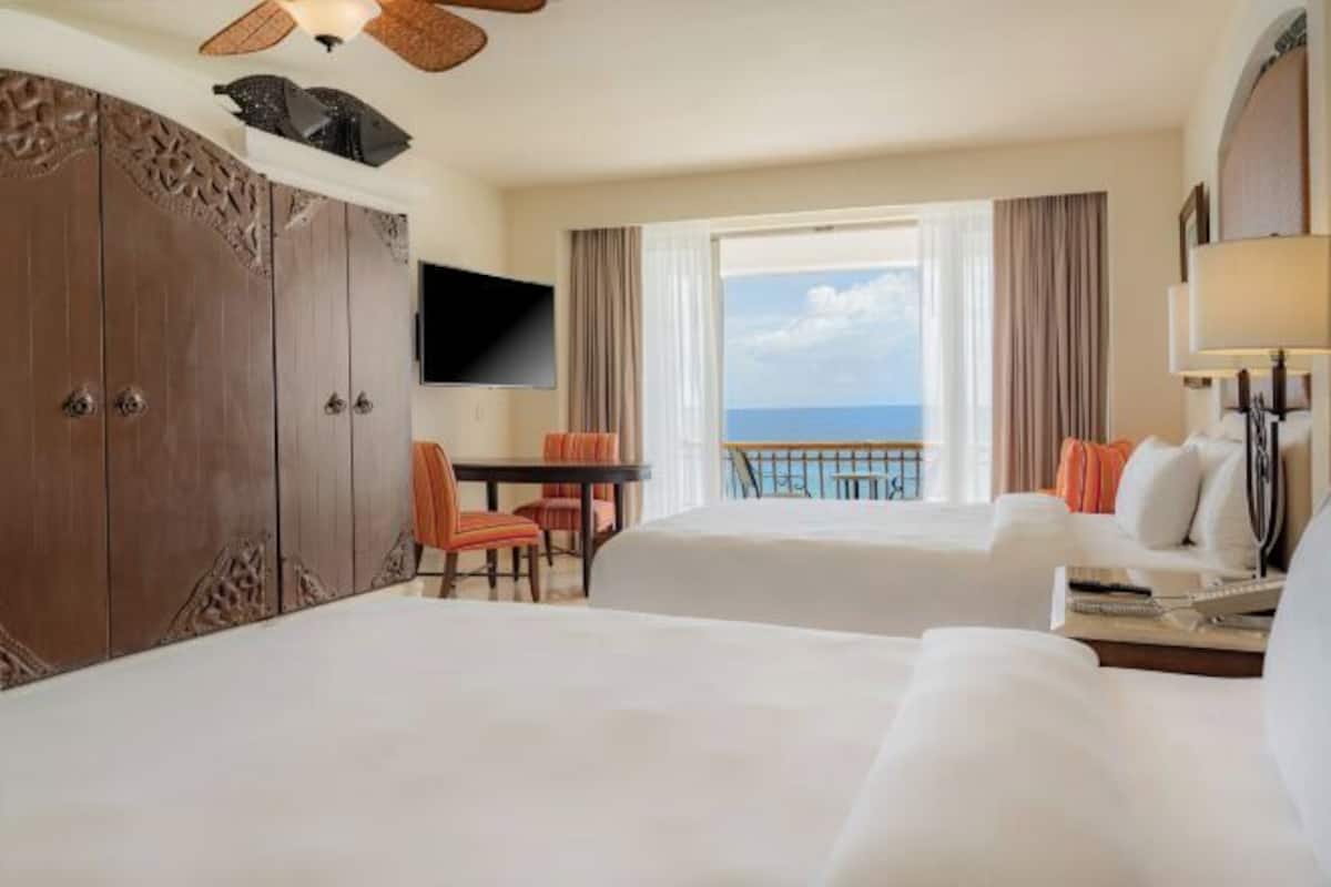 Premium bedding, pillow-top beds, free minibar, in-room safe
