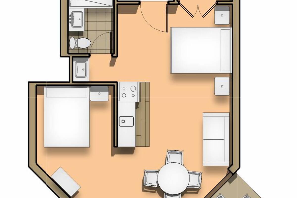Un plan d’étage d’une chambre d’hôtel comprenant un lit, une petite kitchenette, une salle de bain et un coin repas avec une table et des chaises.