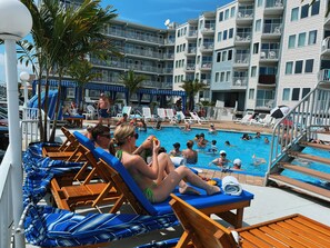 Seasonal outdoor pool, pool umbrellas, pool loungers