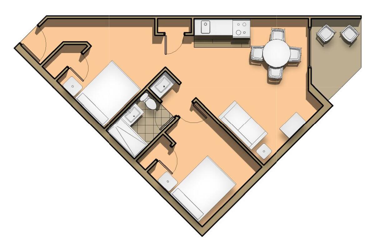 Un plan d’étage d’une chambre d’hôtel comprenant un lit, un bureau, une chaise, une petite salle de bain et un coin cuisine.