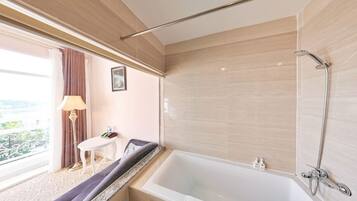 Deluxe Double Room | Bathroom | Bathtub, deep soaking tub, designer toiletries, hair dryer