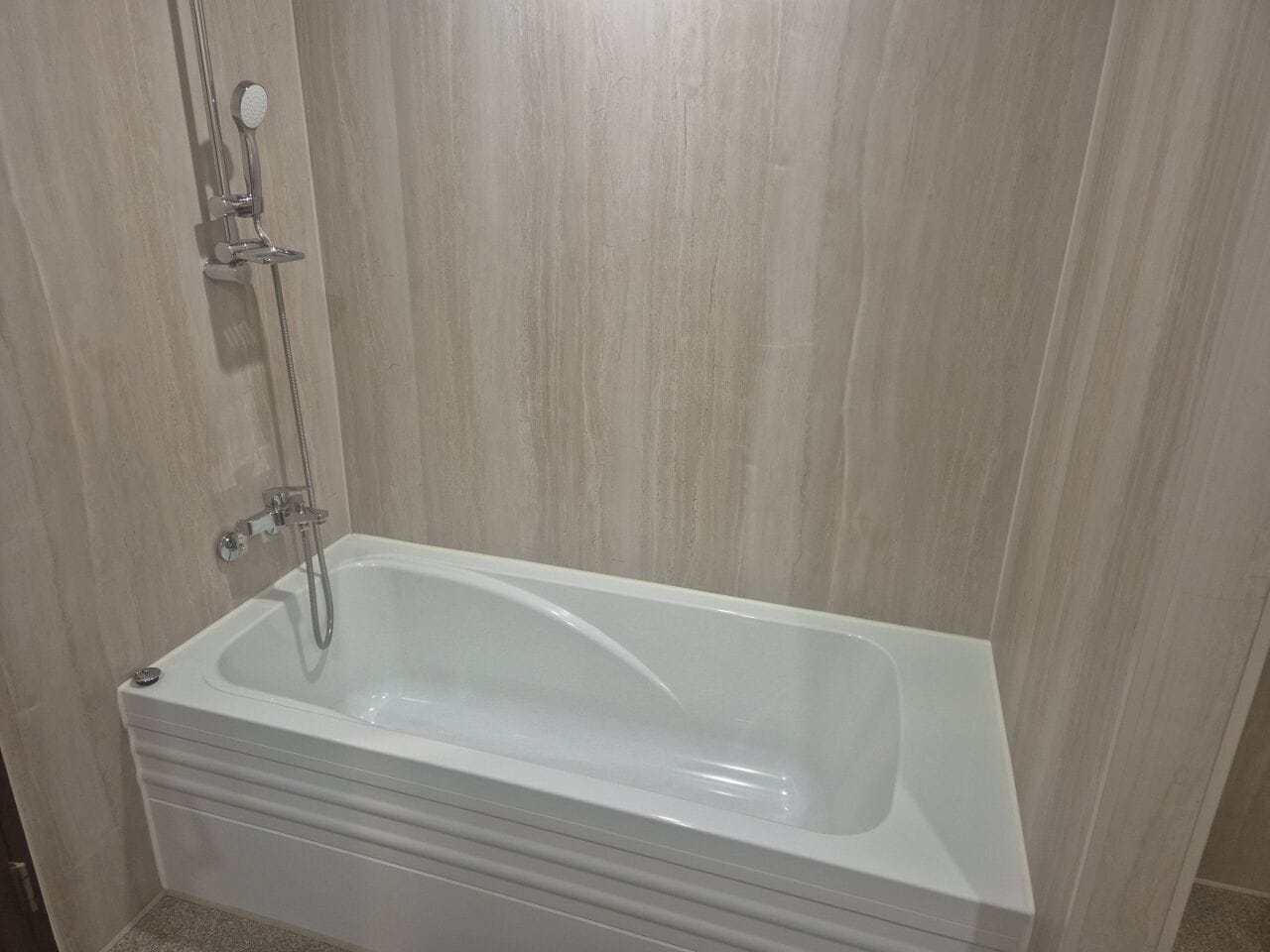 A bathroom with a bathtub, a shower, and a toilet.
