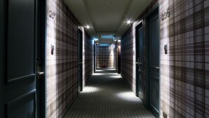 A corridor with doors numbered 207 and 206, leading to rooms. - Urtrip Hotel (Taipei)