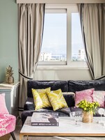 Panoramic Suite, Terrace, Sea View | Living room | Flat-screen TV