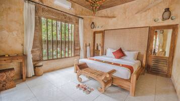 Bungalow, Garden View | Minibar, in-room safe, desk, laptop workspace