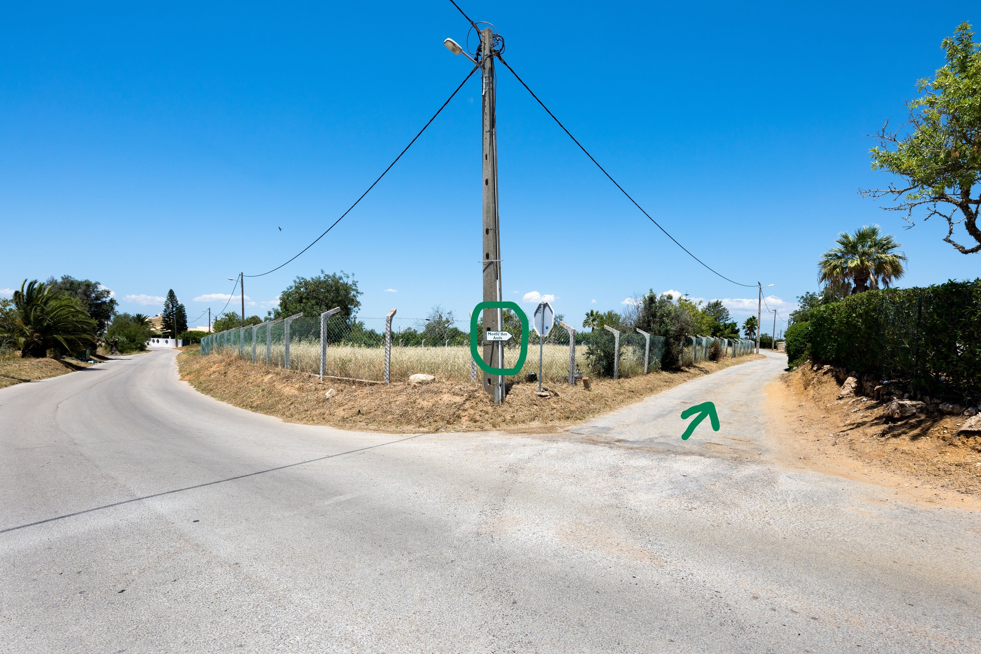 A road intersection with a directional arrow pointing right.