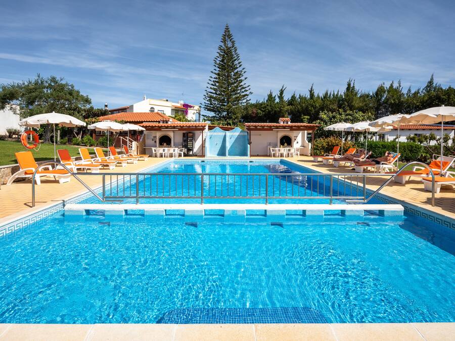 2 outdoor pools, open 8 AM to 10 PM, pool umbrellas, pool loungers