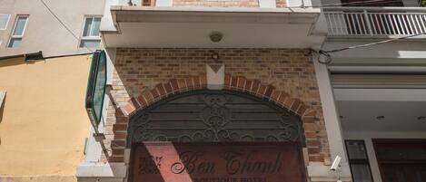 A multi-story building with a prominent entrance labeled "Ben Thanh Boutique Hotel."