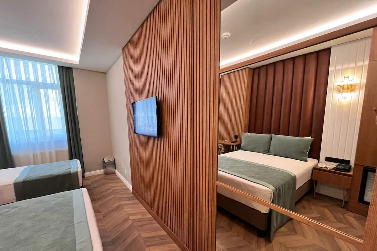 Luxe beddengoed, een minibar, een kluis op de kamer