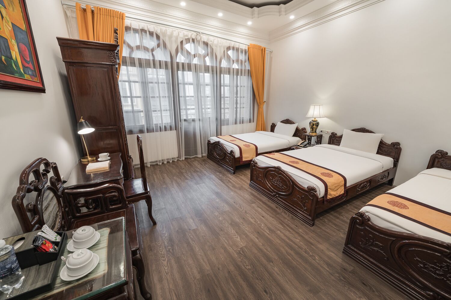 deluxe triple room | minibar, in-room safe, desk, blackout curtains