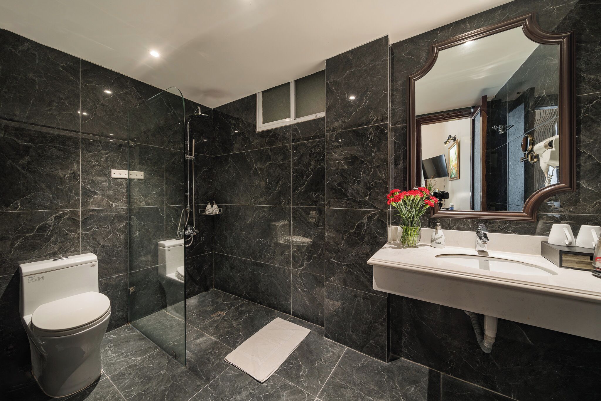 deluxe room | bathroom | spring water bathtub, rainfall showerhead, designer toiletries