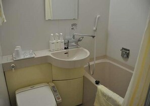 A bathroom with a sink, mirror, shower, and toilet. - Kadoma Public (Kadoma)