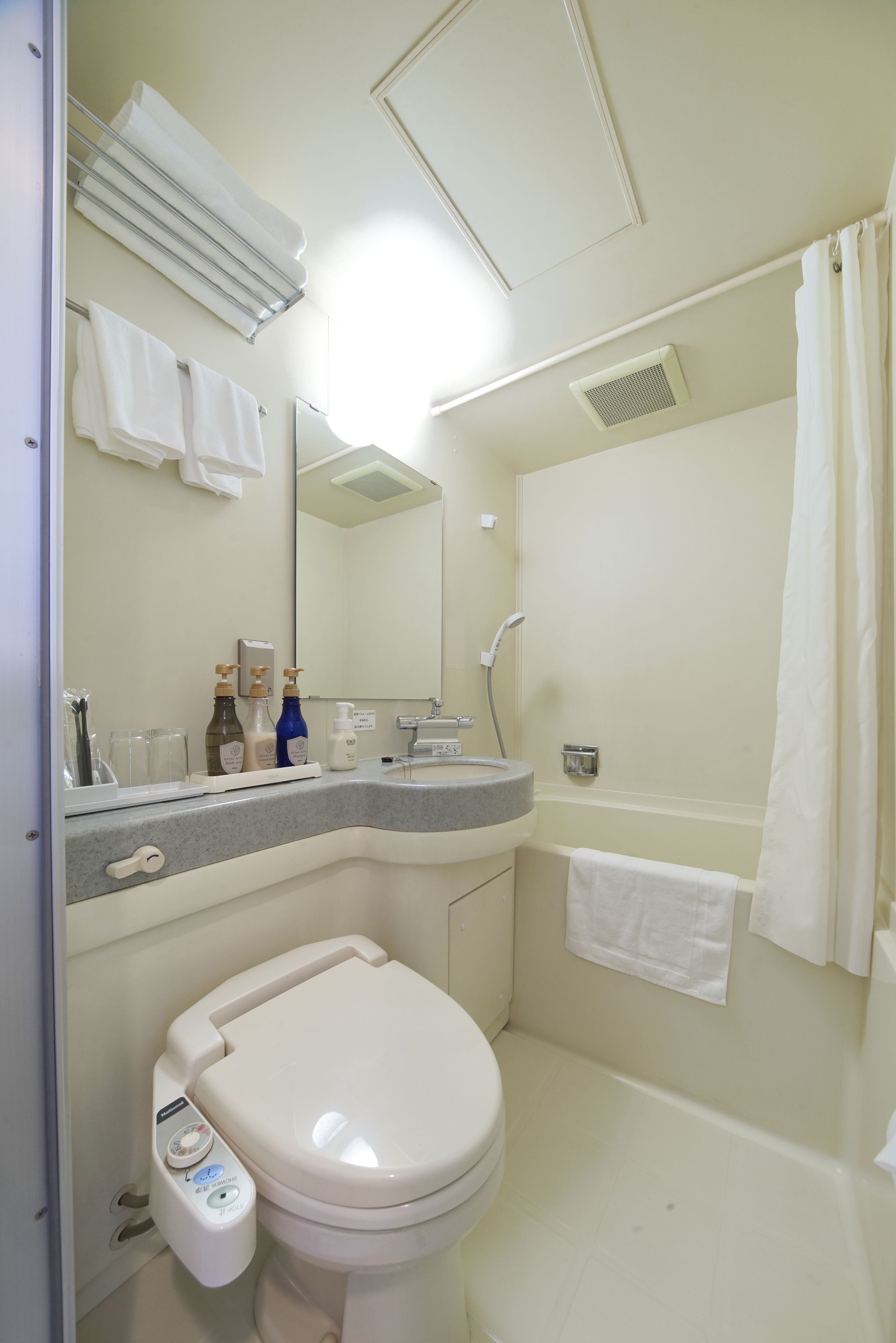 combined shower/bathtub, free toiletries, hair dryer, slippers