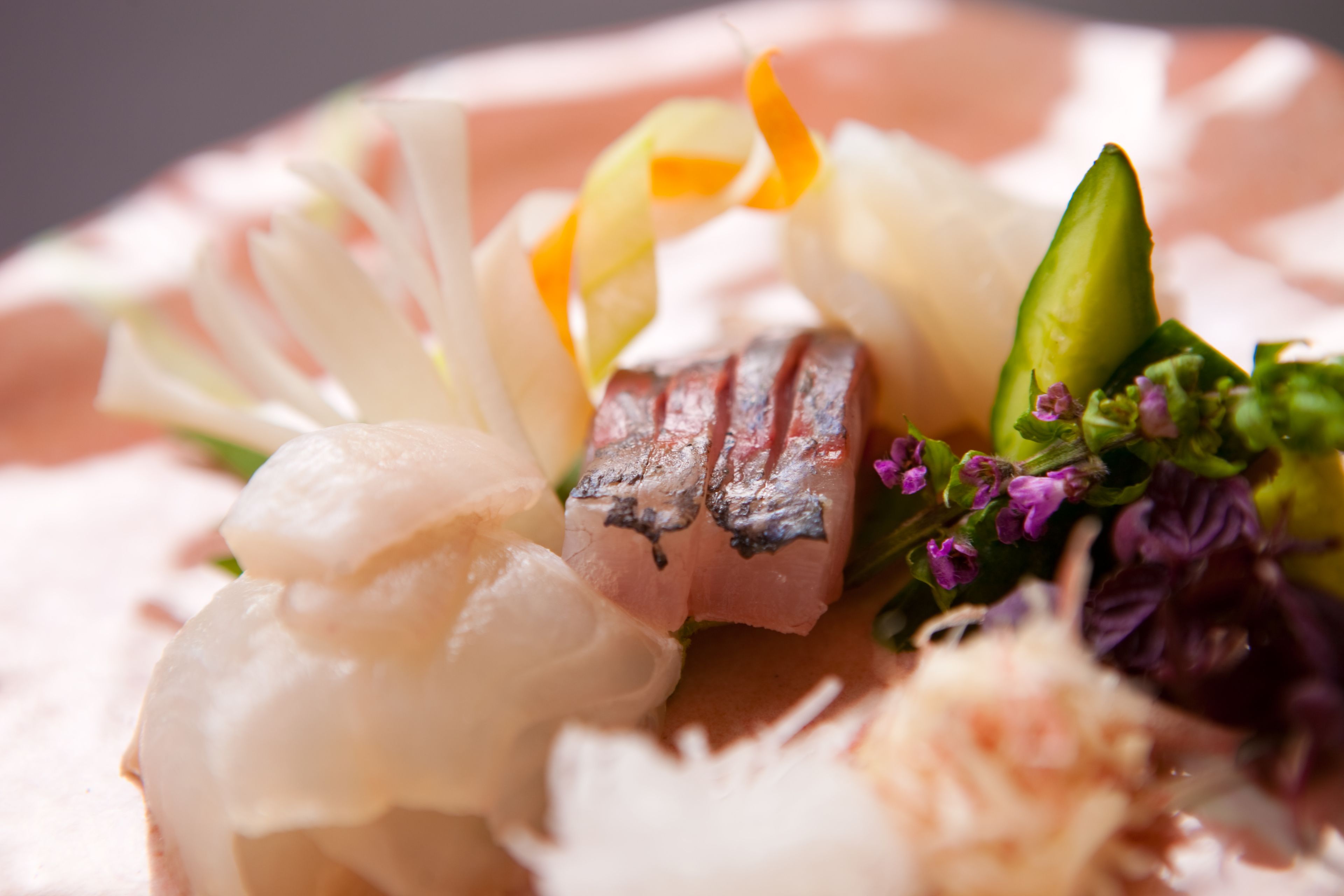 A close-up of a seafood dish with various ingredients.