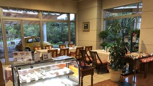 A bakery display with various pastries and a coffee station. - Hotel Marital Sousei Kurume (Kurume)