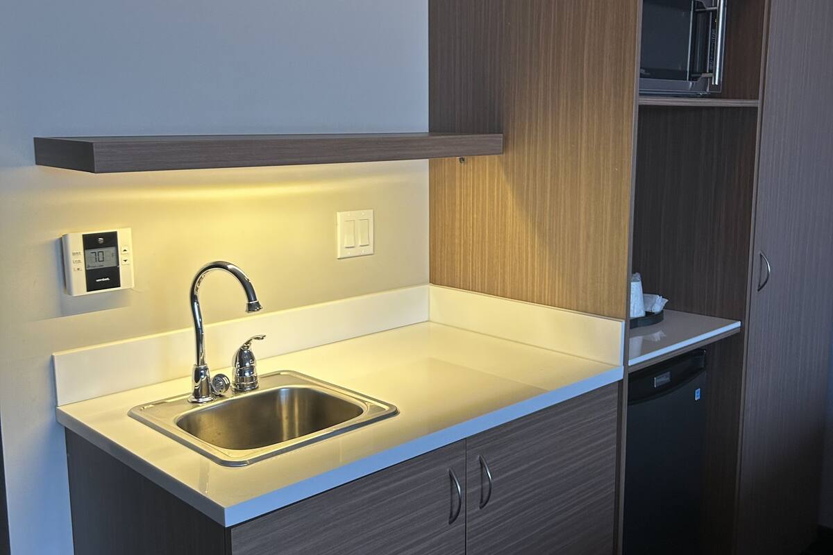 business suite, 2 queen beds, non smoking | desk, laptop workspace, iron/ironing board, free wifi