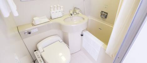A modern bathroom with a toilet, sink, and shower.