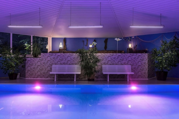 Indoor pool, outdoor pool, pool umbrellas, pool loungers