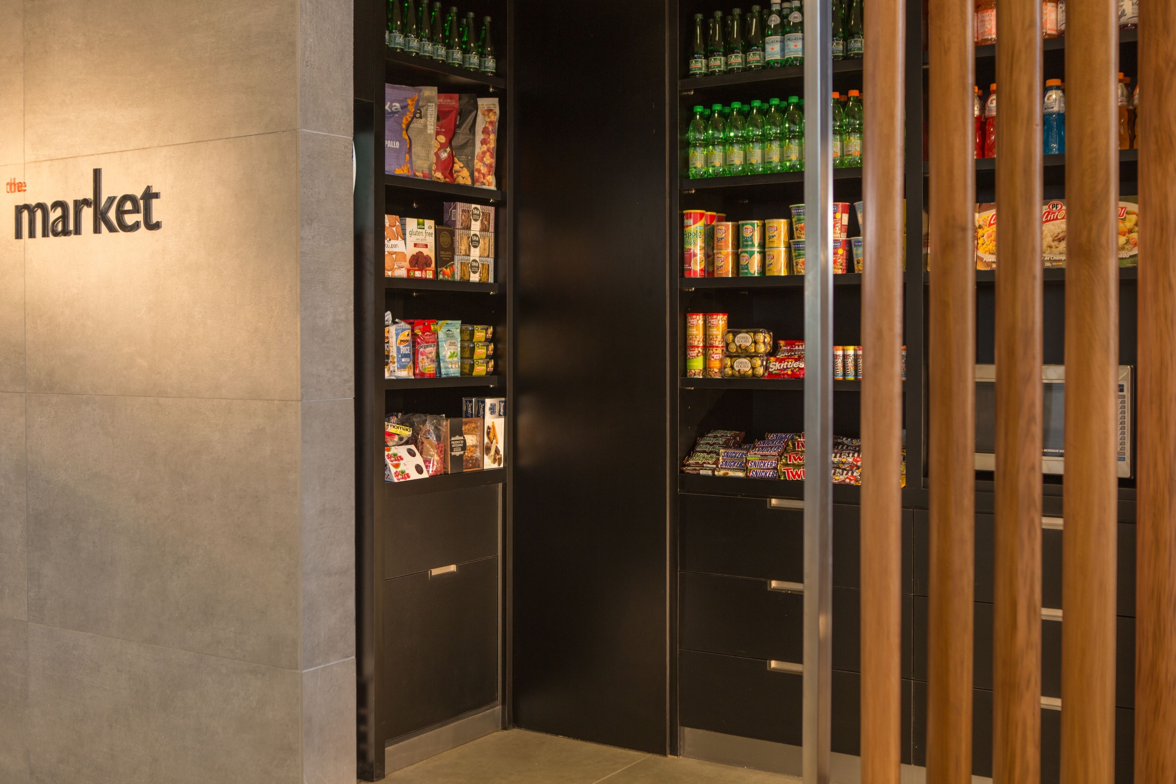 A section of a store with shelves stocked with various products.