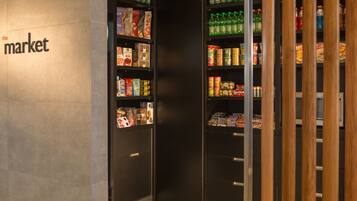 A section of a store with shelves stocked with various products.