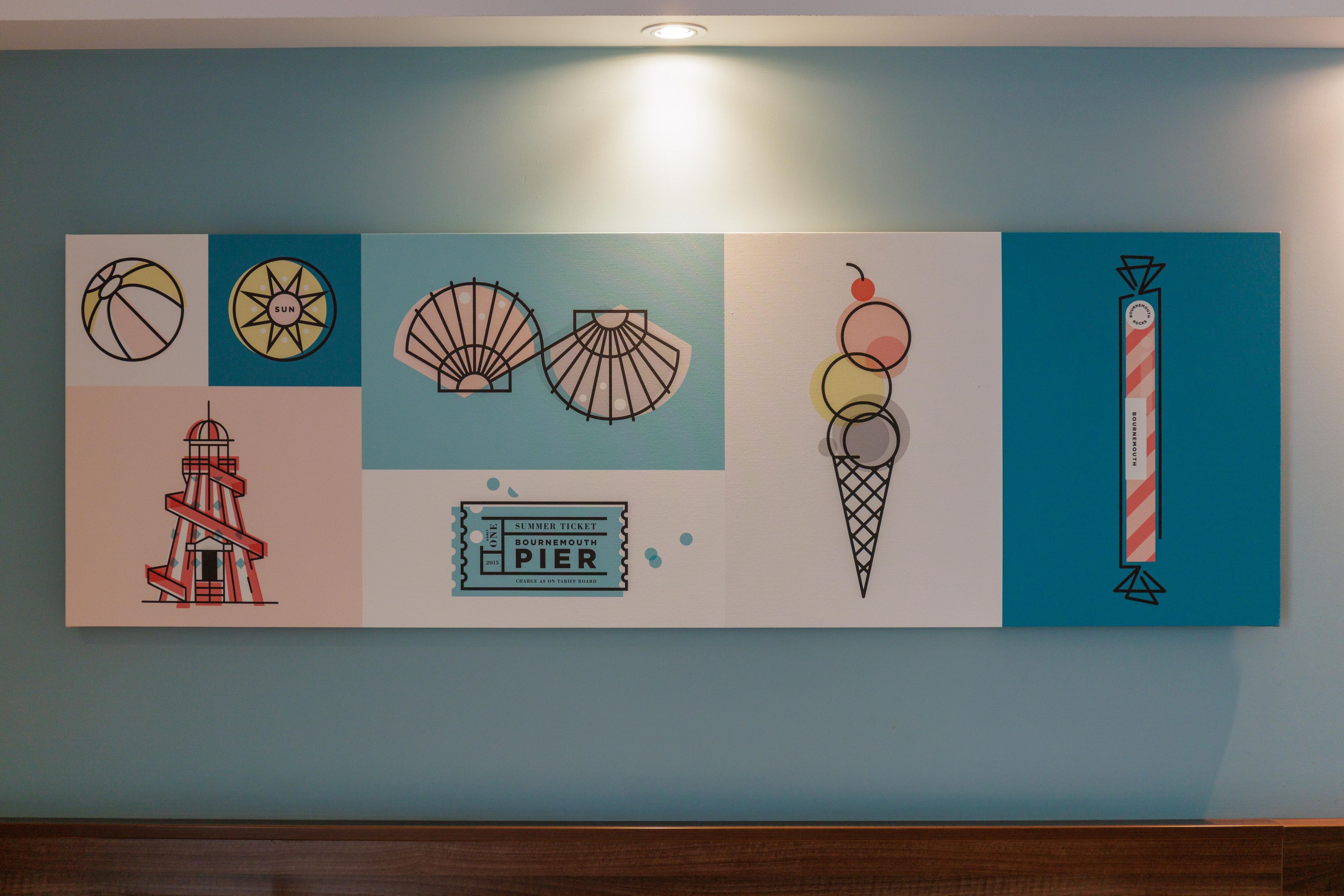A wall with various abstract art pieces.