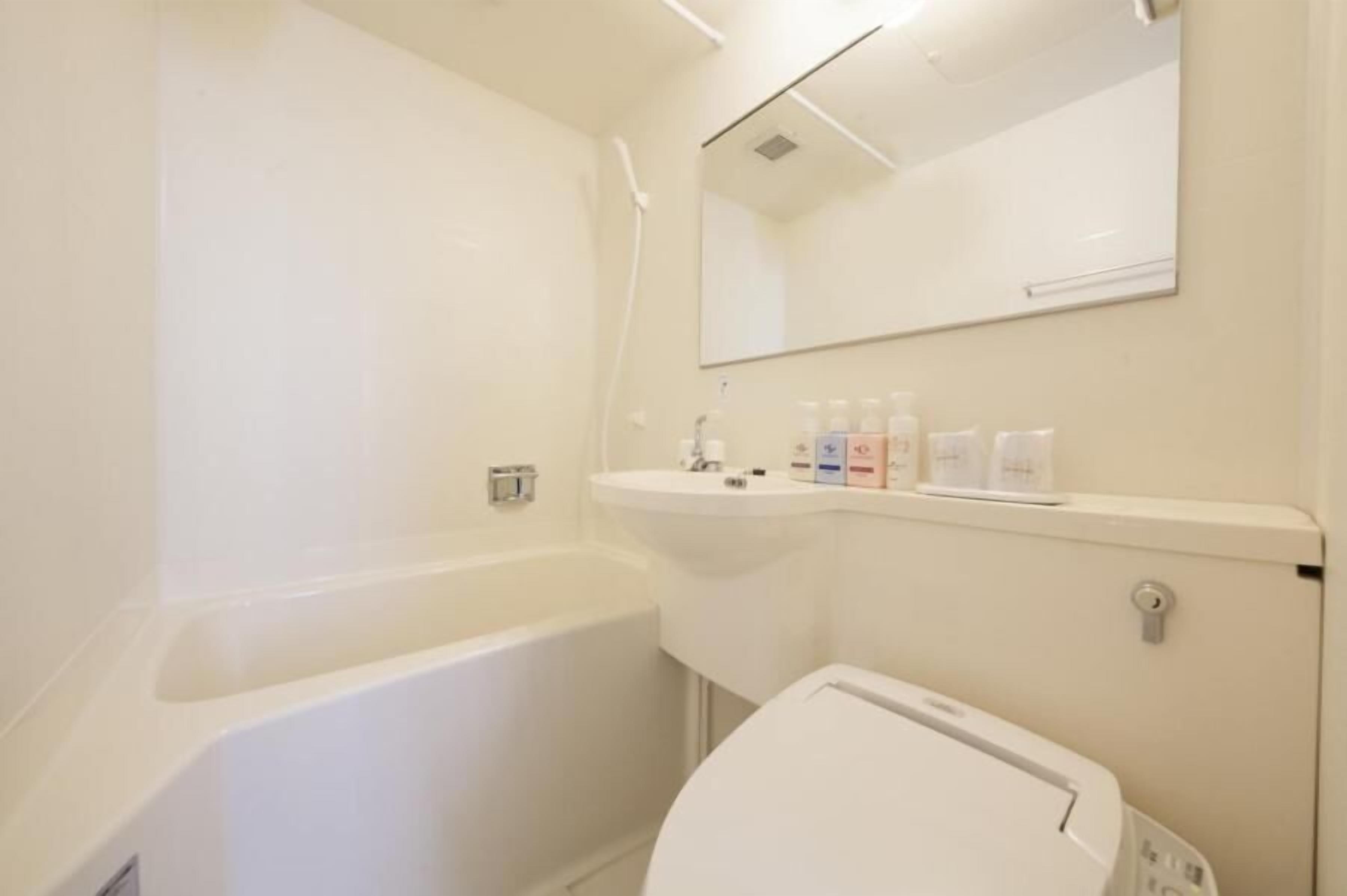 combined shower/bathtub, free toiletries, hair dryer, dressing gowns