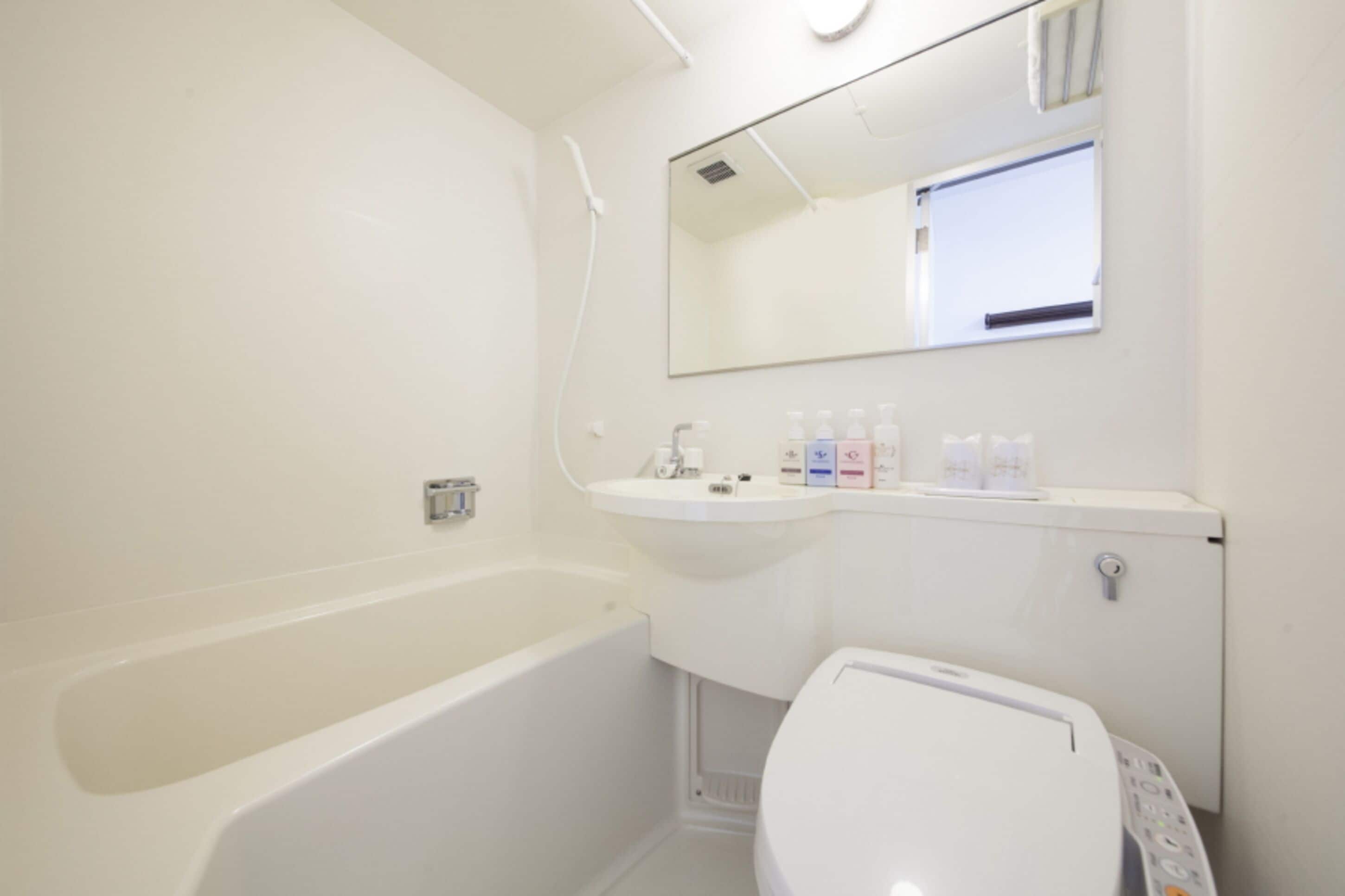 combined shower/bathtub, free toiletries, hair dryer, dressing gowns