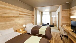 A hotel room with two beds, a desk, a TV, and a large mirror. - Fontana No Oka Kamo (Aira)