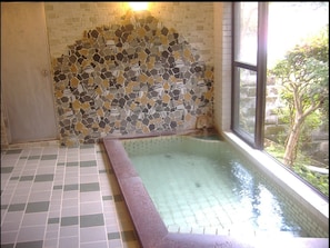 Separate tub and shower, free toiletries, hair dryer, slippers