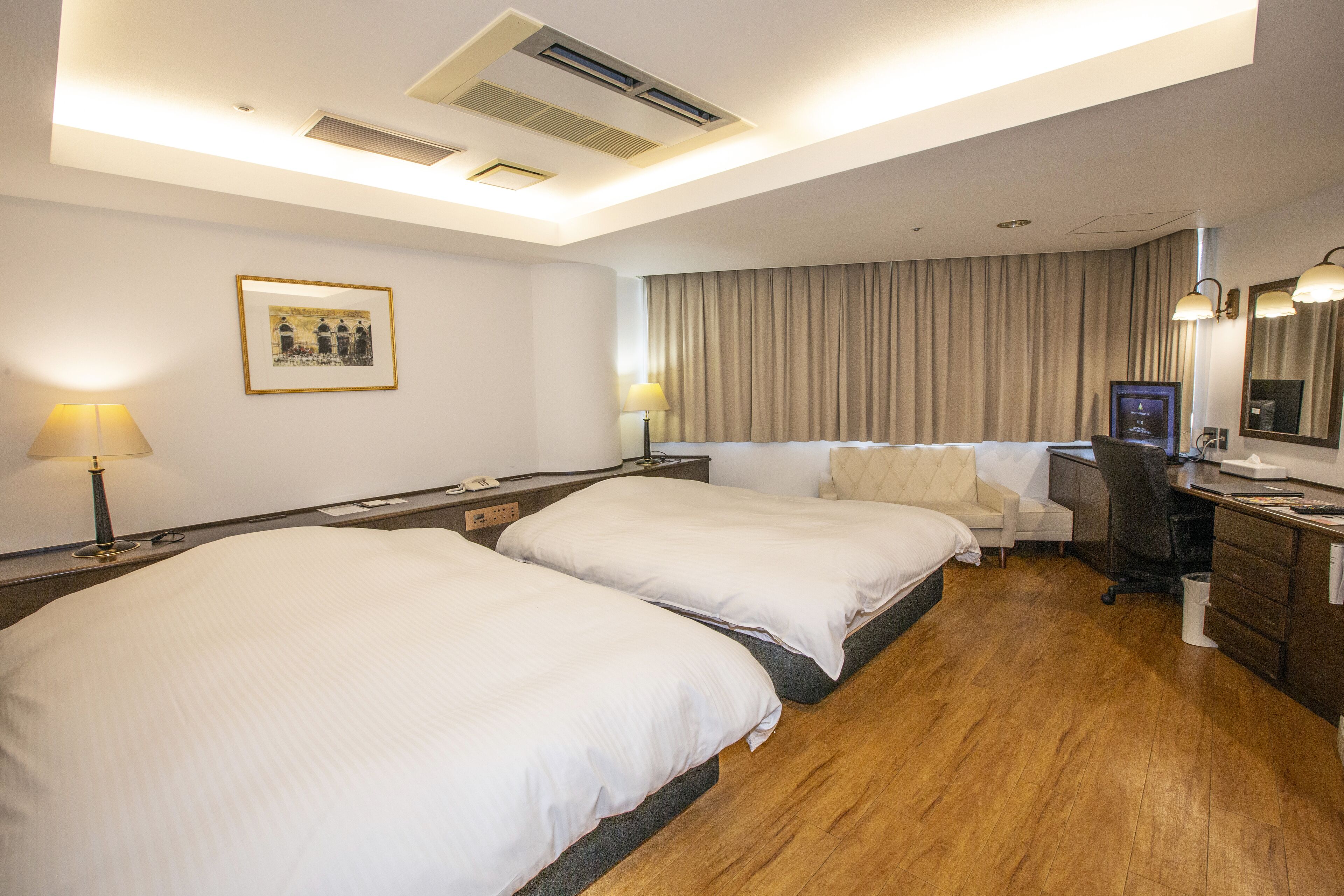 deluxe twin room, non smoking | desk, laptop workspace, blackout curtains, iron/ironing board