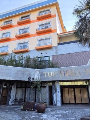 A building with a sign reading "TOP MEGA." - Harazuru Onsen Hotel Topmega Itoen (Asakura)