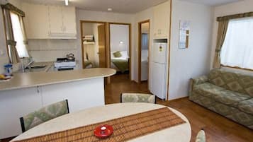Comfort Cabin, Balcony, River View | Living area | Flat-screen TV