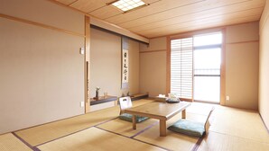A traditional Japanese room with tatami flooring, a low wooden table, and sliding shoji doors. - Temple Stay Tsushima Seizanji (Tsushima)