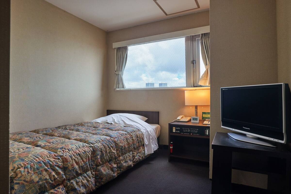 Desk, blackout drapes, iron/ironing board (on request), WiFi (free)